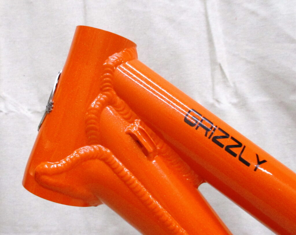 Ventana Grizzly MTB-Tandem. Steuerrohr linke Seite Farbe Mango Tango